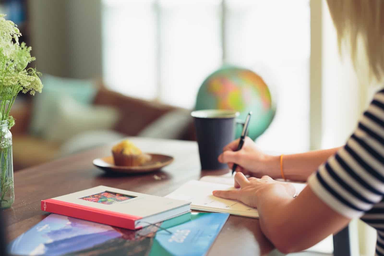 Person writing in calendar