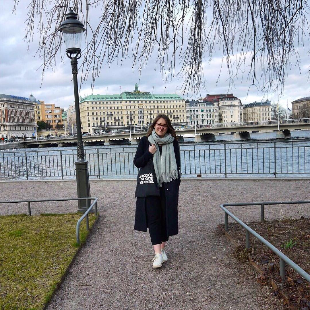 Girl by the water view in a city